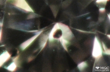 The inclusion of pyrope in natural diamond. View mode - dark-field lighting.
