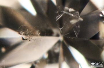 Inclusions like "diamond in diamond" in natural diamond. View mode - dark Inclusion of the type "diamond in diamond" in natural diamond. View mode - dark-field lighting.