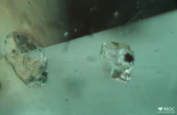 Inclusion of calcite in natural emerald (Central African region). View mode - dark lighting.
