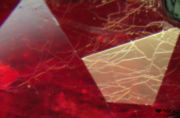 Glass-filled cracks in refined ruby. View mode - reflected light.
