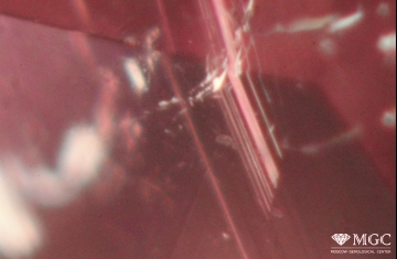 Tubular inclusions in natural heat-treated elbaite. View mode - dark field lighting